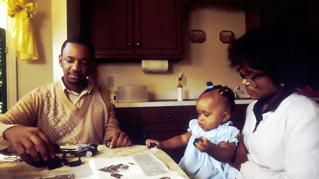 A family sitting together at a kitchen table