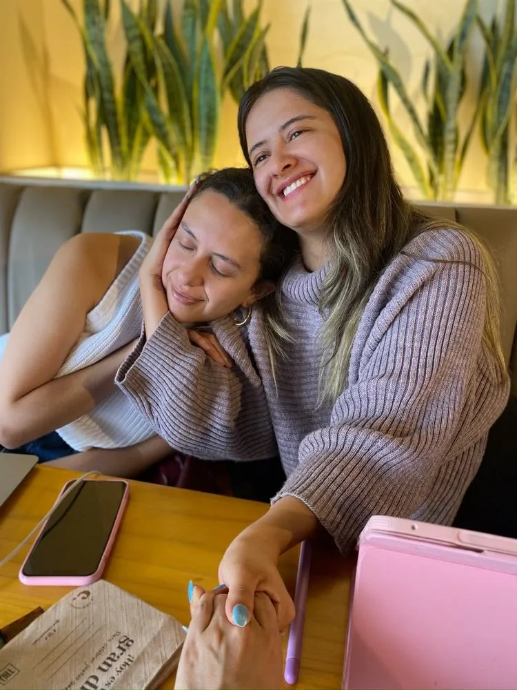 Sharon embracing a friend